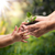 Adult Handing Green Plant for Healing of Inner Child