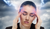Women holding forehead afflicted