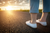 Woman in sneakers on long paved road